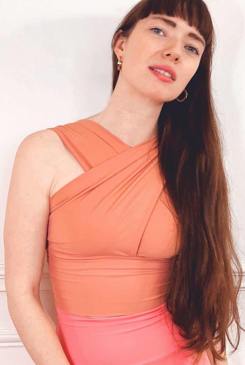 The Draped top is designed with the 50s in mind, and we promise you that this top will bring some extra elegance and beauty into your yoga practice and your everyday life.